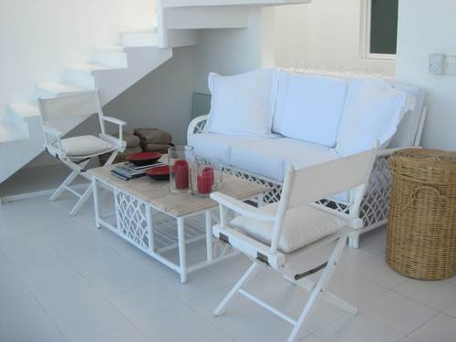 Seating area on first floor, next to staircase to top floor