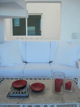 Seating area on first floor, next to staircase to top floor